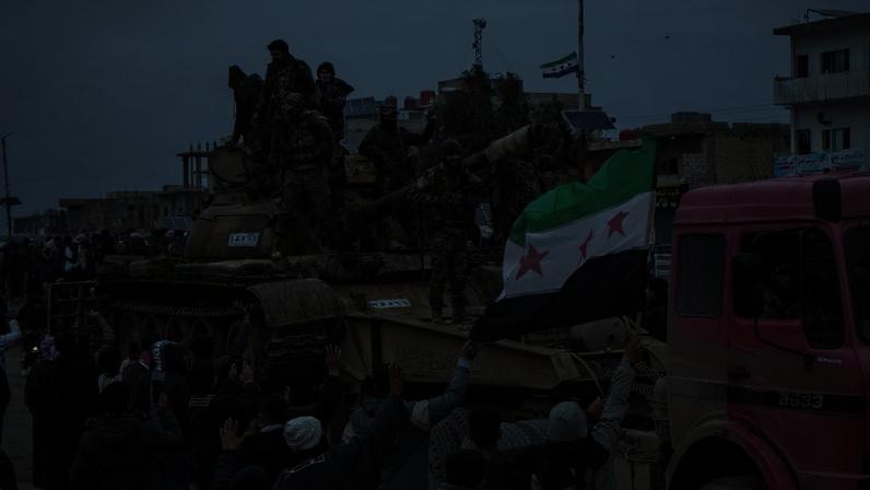 People celebrate the entry of Syrian army forces into the Deir Hafer area after the withdrawal of the Kurdish-led Syrian Democratic Forces (SDF), in Deir Hafer, eastern Aleppo countryside, Syria, 17 January 2026. EPA/AHMAD FALLAHA