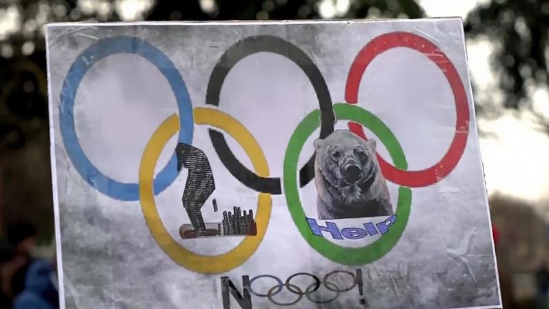 Cartaz com caricaturas do presidente dos EUA, Donald Trump, e do primeiro-ministro israelita, Benjamin Netanyahu