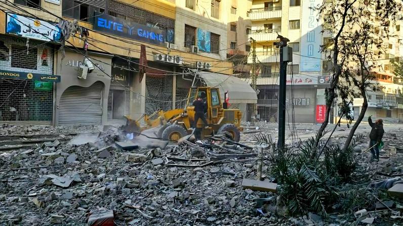 Workers use a bulldozer to clear debris from a street at the site of overnight Israeli airstrikes in the southern suburbs of Beirut on March 6, 2026. Heavy attacks were reported in Tehran on March 6 after Israel said it was hitting "regime infrastructure" in a "new phase" of the war it launched with the United States against Iran. As the conflict entered its seventh day, its regional repercussions continued -- with Qatar saying it intercepted a drone targeting a US base, and Lebanon reporting the death toll from Israeli strikes had risen to 123.