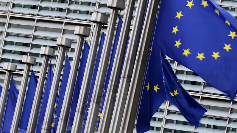 European Union flags flap in the wind outside EU headquarters in Brussels, Wednesday, Sept. 3, 2025.