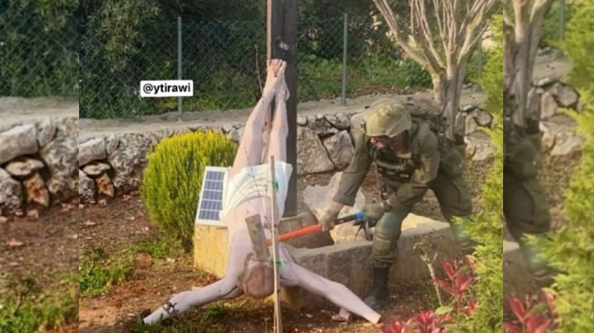 Imagem de um soldado das FDI a profanar uma estátua de Jesus no Sul do Líbano