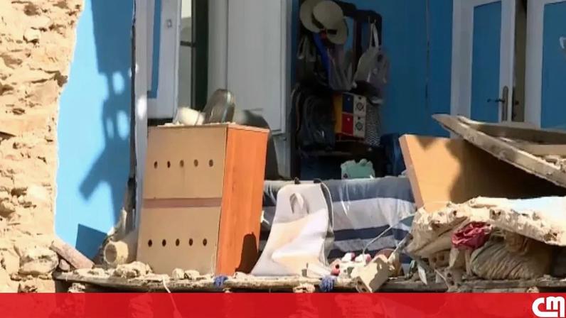 Edifício parcialmente destruído após parede desabar sobre carros em Faro