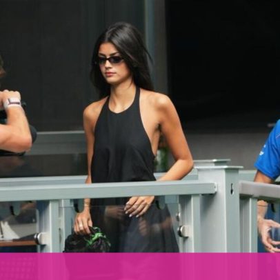 Pierre Gasly ajuda a segurar o vestido de Kika Cerqueira Gomes durante evento